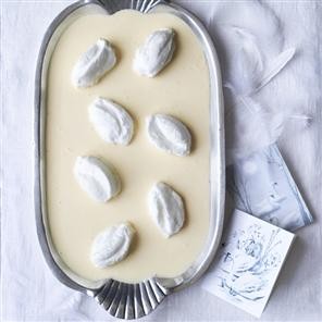 Meringue swans with orange custard