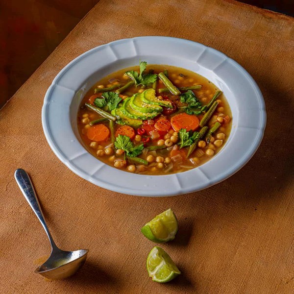 Mexican vegetable soup with lime and avocado