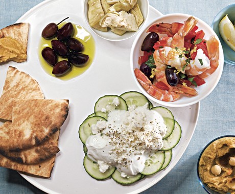 Meze platter with hummus, shrimp salad, and cucumber salad
