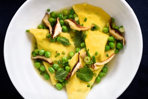 Mezzelune pasta with peas and shiitake mushrooms