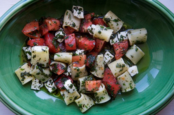 Mezzi rigatoni with tomatoes, lots of herbs, hot oil, and mozzarella