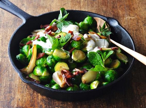 Middle Eastern braised Brussels sprouts with speck, yoghurt and herbs