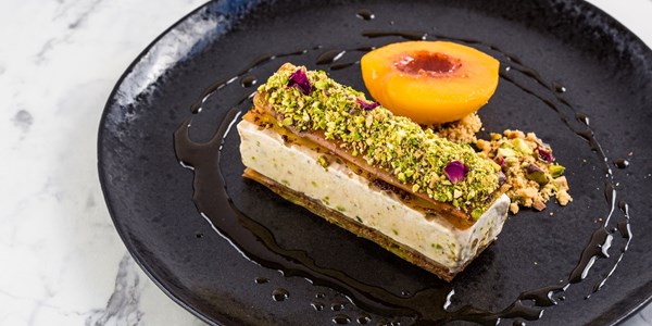 Middle Eastern ‘ice cream sandwich’ with poached peaches