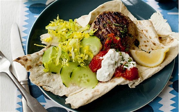Middle Eastern lamb burger with minted yogurt and hot tomato sauce