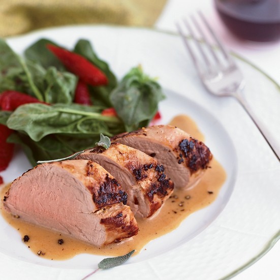 Milk-braised pork tenderloin with spinach and strawberry salad