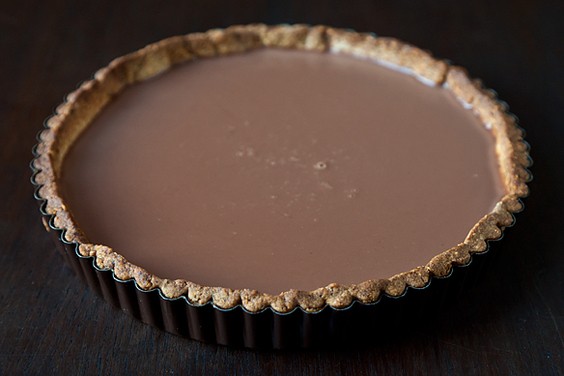 Milk chocolate nutmeg tart with hazelnut crust