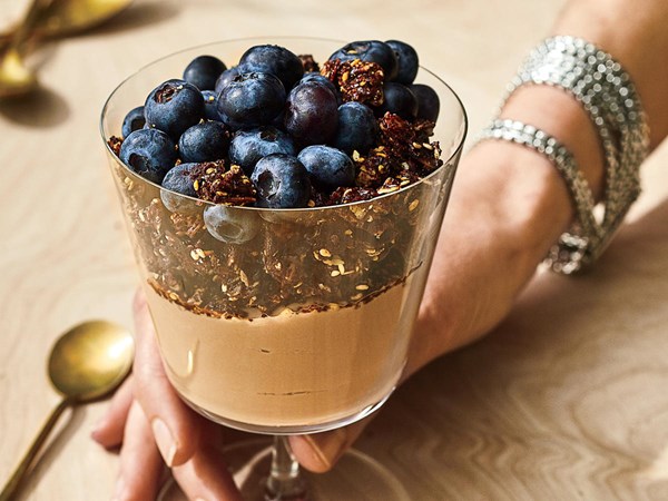 Milk chocolate yogurt with granola and blueberries