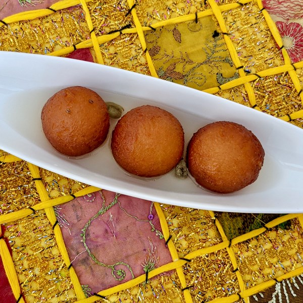 Milk dumplings in rosewater syrup (Gulab jamuns)