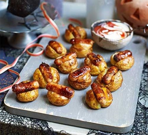 Mini baked potatoes with sticky sausages