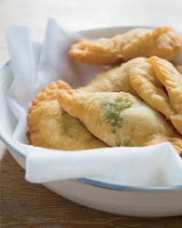Mini calzones stuffed with pepperoni, pesto and ricotta
