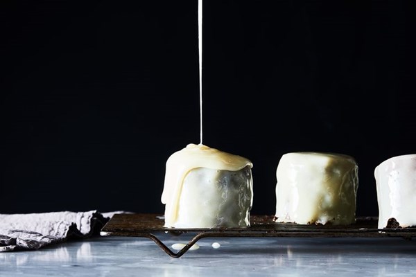 Mini chocolate layer cakes with whipped ganache & white chocolate glaze