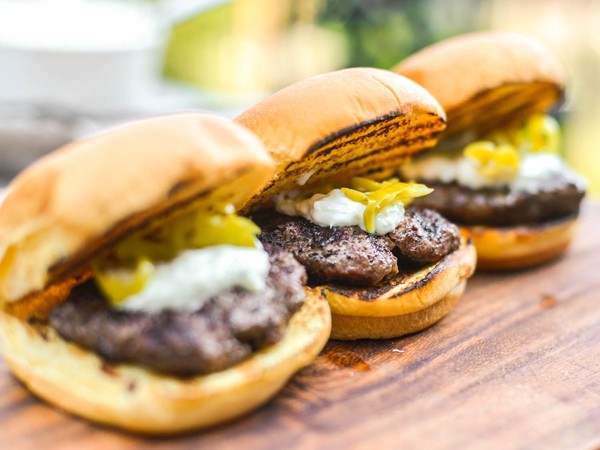 Mini grilled gyro burgers with tzatziki and pickled peperoncini