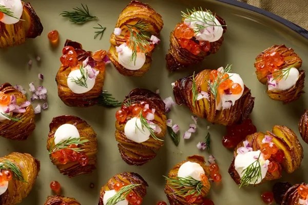 Mini Hasselback potatoes with crème fraîche & caviar