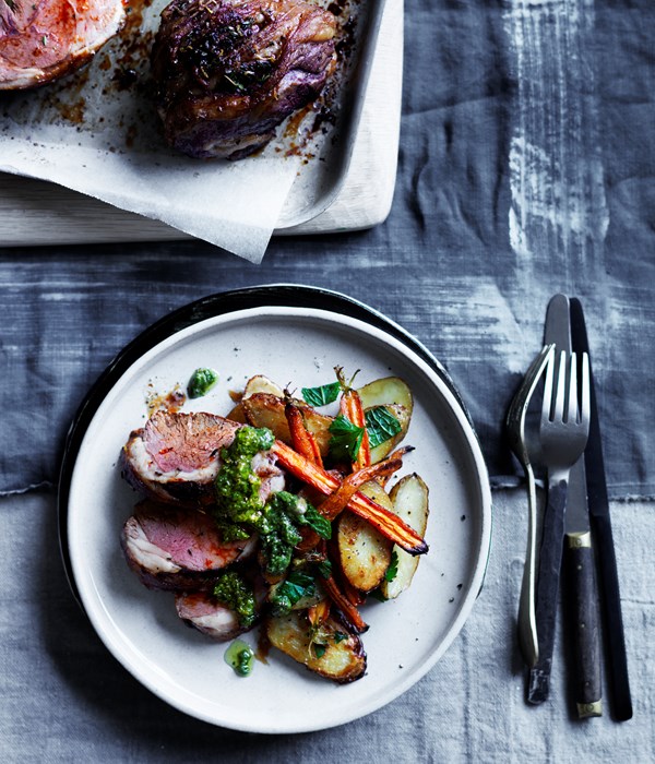 Mini lamb roasts with baby carrots, kipflers and carrot-top pesto
