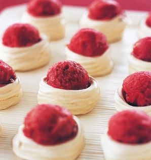 Mini meringue baskets filled with pomegranate sorbet