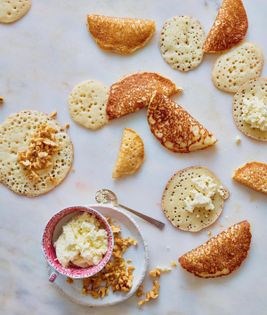 Mini-pancakes with ashta and walnut filling (Qatayef)