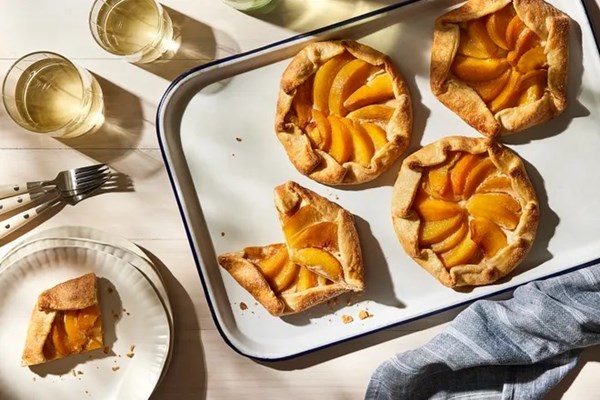 Mini peach galettes with cardamom and goat cheese