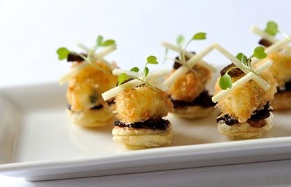 Mini red onion marmalade tarts with blue cheese, pickled walnut and pear