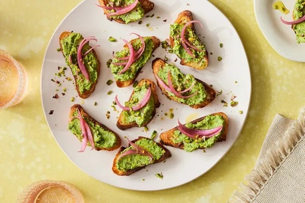 Minty pea toasts with pickled onions