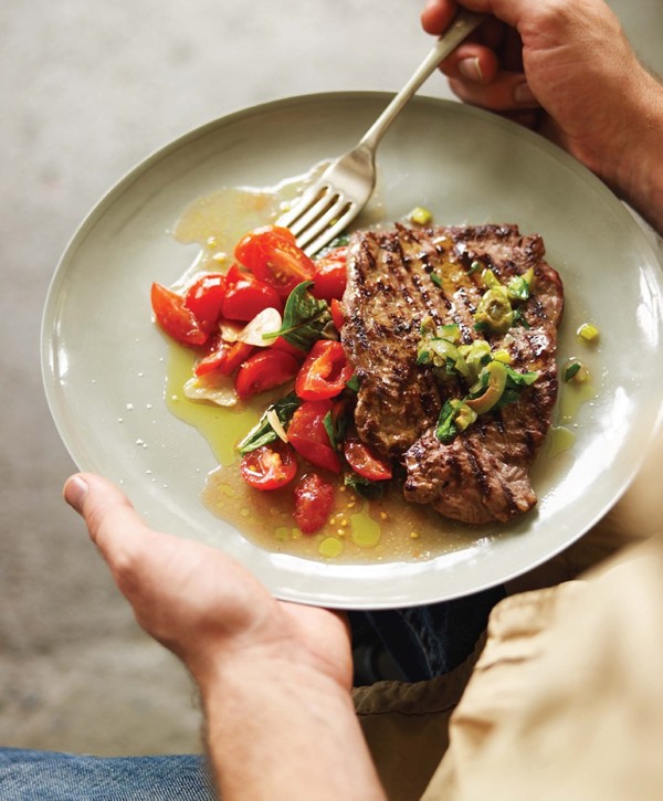Minute steak with green olive dressing & tomato salad