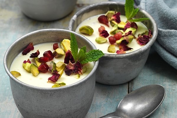 Mishti doi with pomegranate and mint