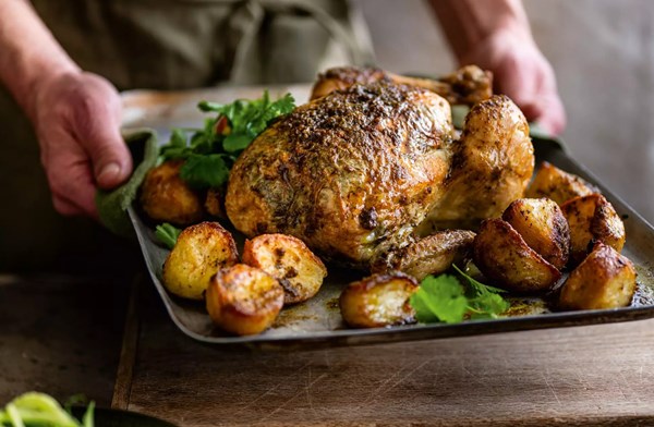 Miso, coriander & ginger butter-stuffed roast chicken and potatoes