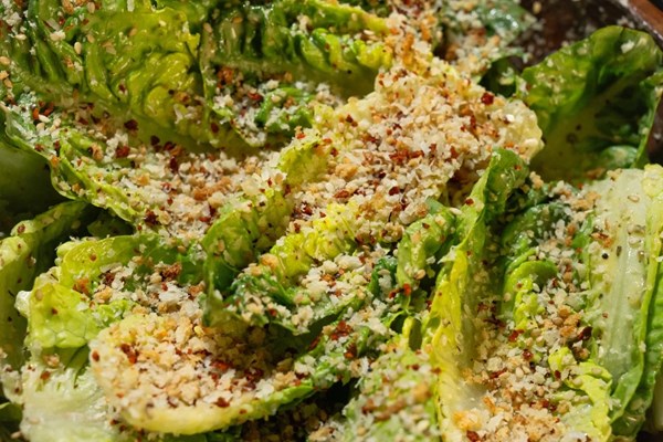 Miso-Parmesan Caesar salad with shaved mushrooms and panko-sesame sprinkles
