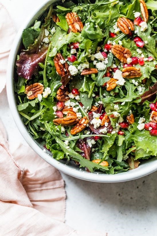 Mixed baby greens with pomegranate seeds, Gorgonzola and pecans