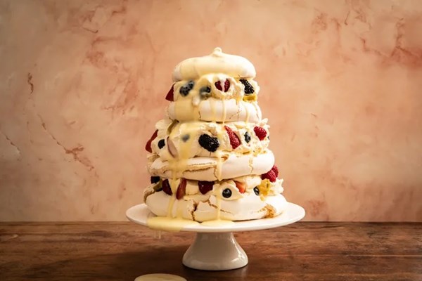 Mixed berry Pavlova with poached rhubarb and orange-ginger curd