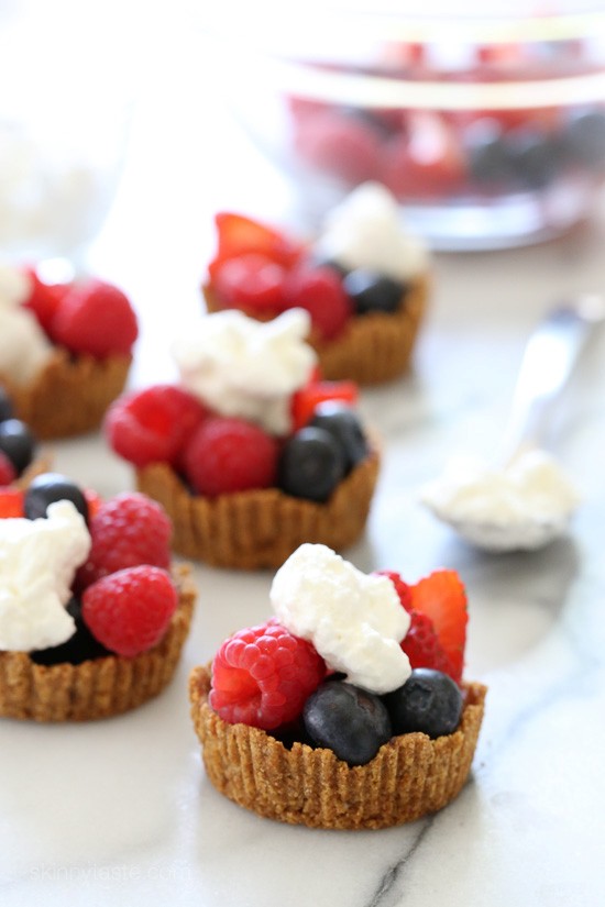 Mixed berry tartlet with dark chocolate and vanilla whipped cream