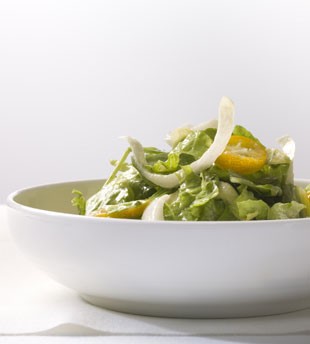 Mixed bitter greens and kumquat salad with anchovy vinaigrette