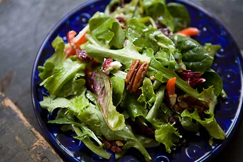 Mixed green salad with pecans, goat cheese, and honey mustard vinaigrette