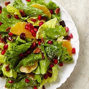 Mixed green salad with pomegranate, dates & bacon