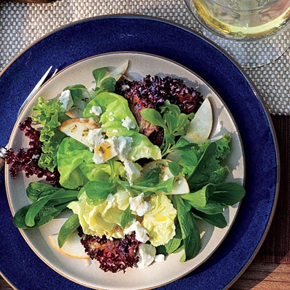 Mixed lettuce, pear, and goat cheese salad with citrus dressing