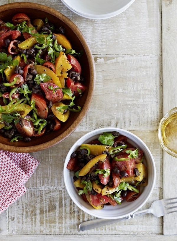 Mixed tomato and black bean salad with mustard seed dressing