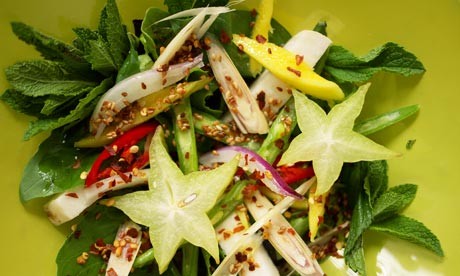Mixed vegetable and fruit salad dressed with tamarind, palm sugar and sesame seeds
