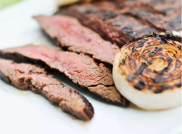 Mojo marinated flank steak with grilled onions 