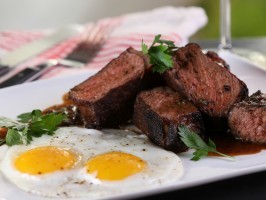 Mole-rubbed steak and eggs with chocolate stout beurre blanc