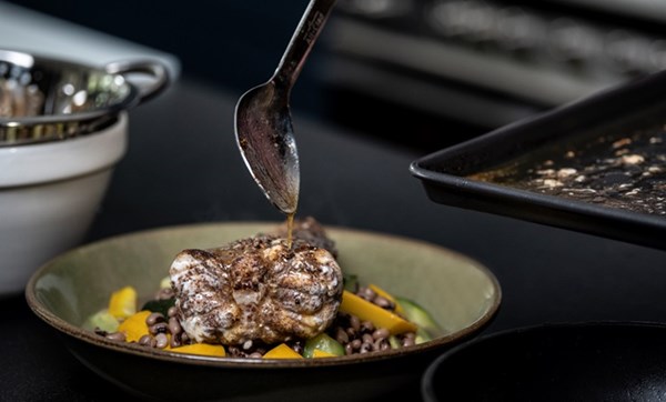 Monkfish with clams, black-eyed beans and courgettes