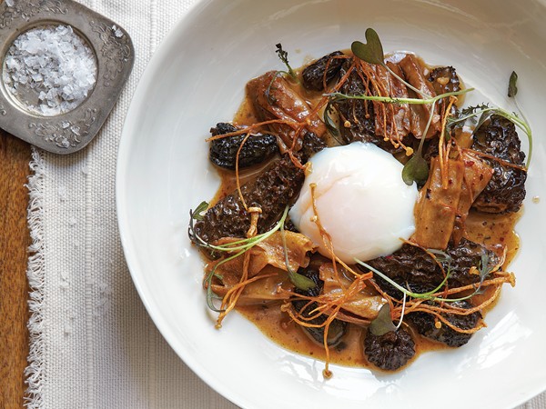 Morels in black bean sauce with fried enoki mushrooms
