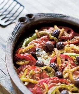 Moroccan fish tagine with tomatoes, olives, and preserved lemons