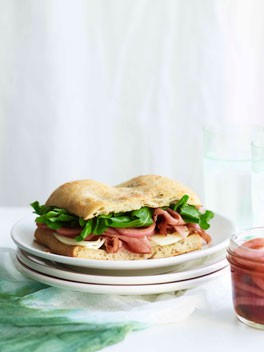 Mortadella sandwich with pickled onions and provolone