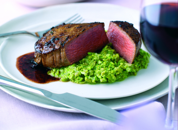 Mouth-watering fillet steaks with a tarragon and shallot butter, served on a bed of pea puree
