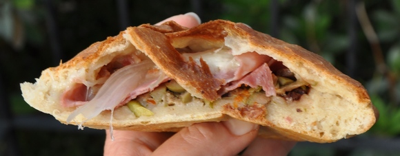 Mozzarella, prosciutto and olive salad stromboli