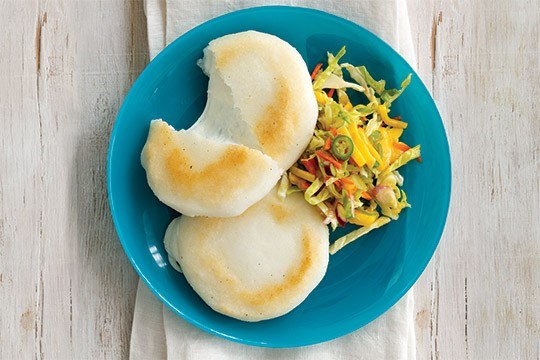 Mozzarella-stuffed arepas with sherry-mango slaw