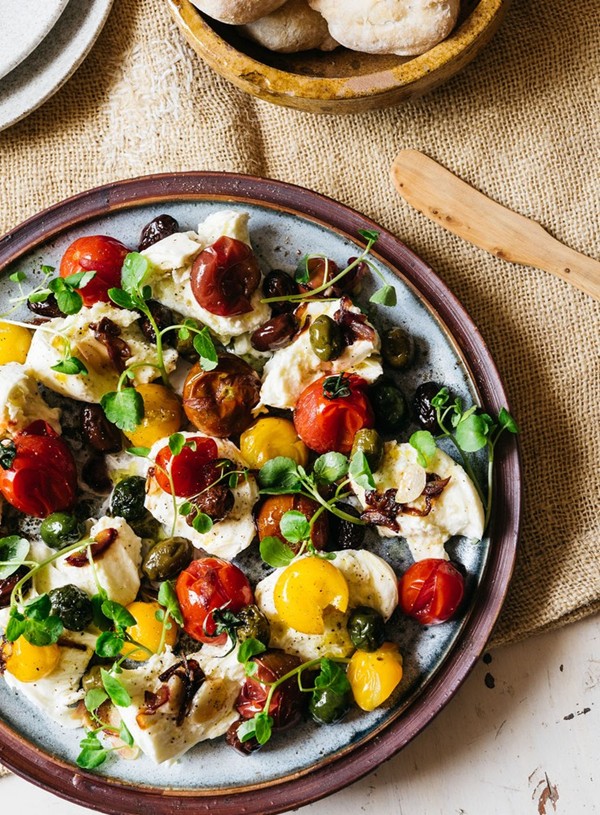 Mozzarella with warm tomato and olive vinaigrette