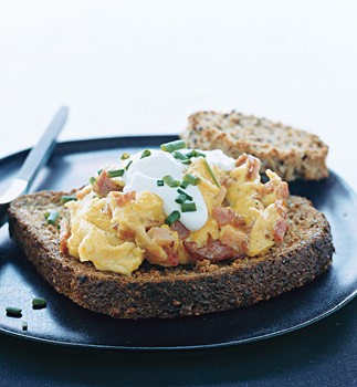 Multigrain toasts with scrambled eggs and Canadian bacon