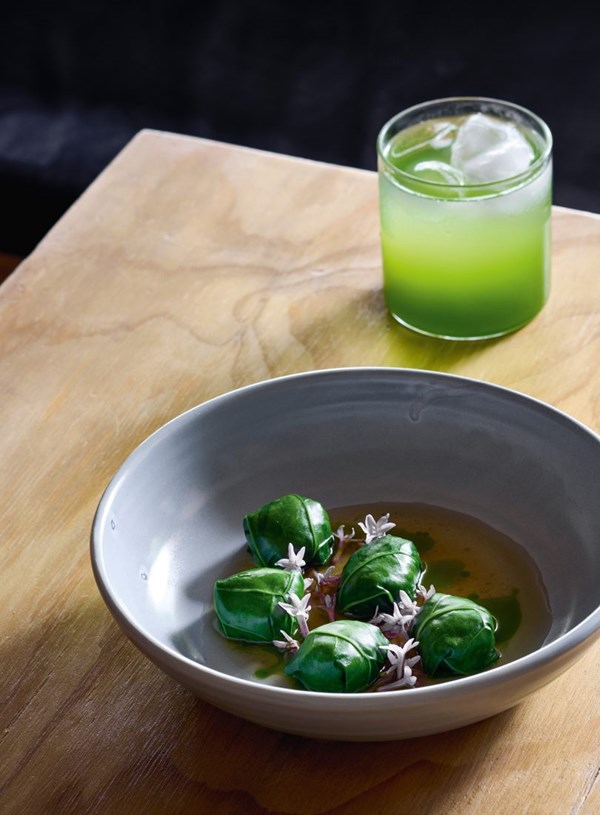 Mushroom & pickled leek dumplings, broth & charred garlic chive oil