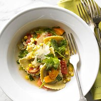 Mushroom agnolotti with corn, tomatoes, and arugula pan sauce