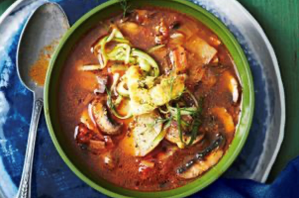 Mushroom and potato soup with croutons and cucumber pickle